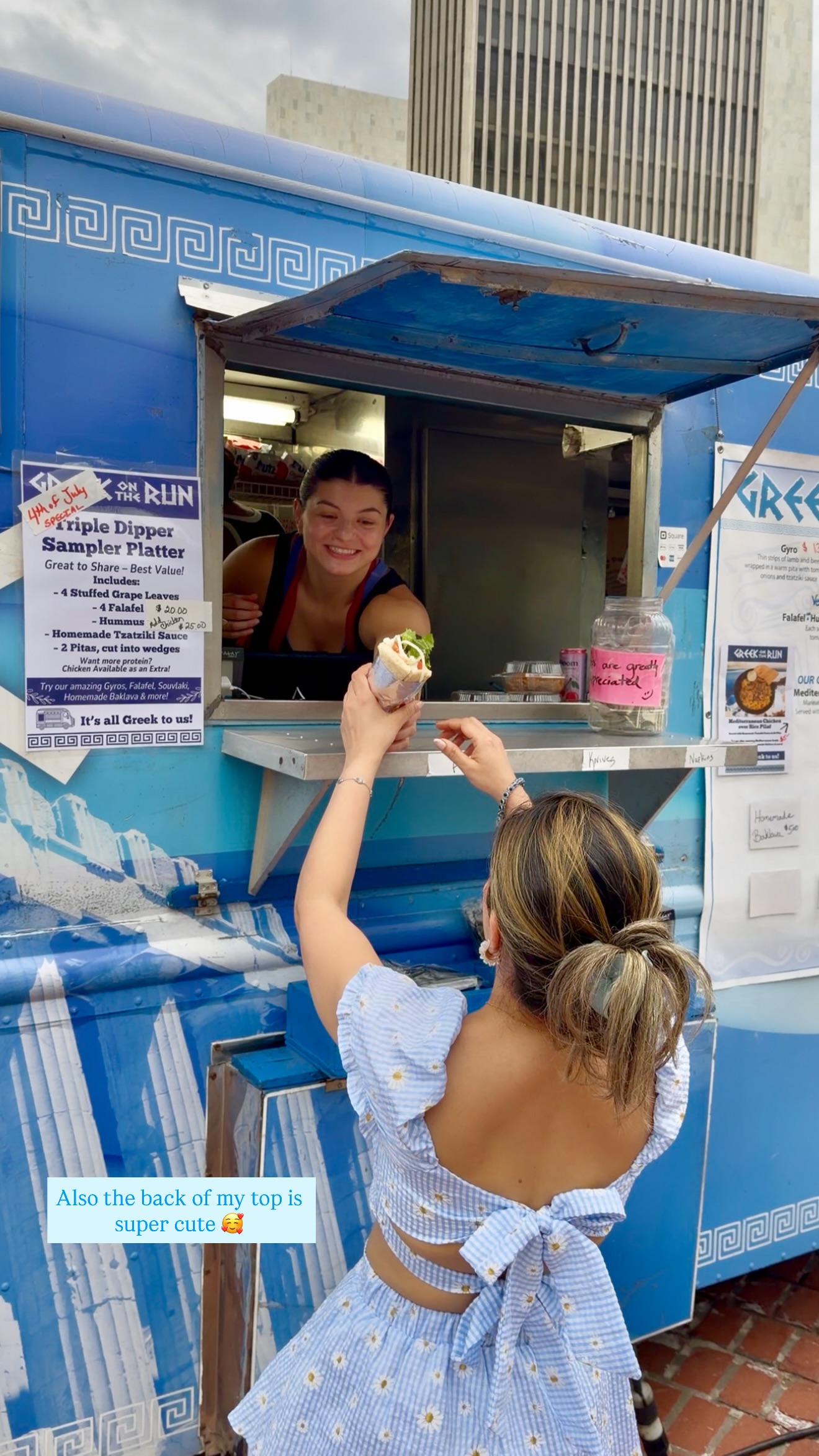 Food vendor serving a falafel wrap at an Albany 4th of July stand