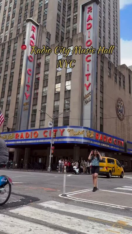 Roopsi Bansal on a street corner outside Radio City Music Hall in New York City