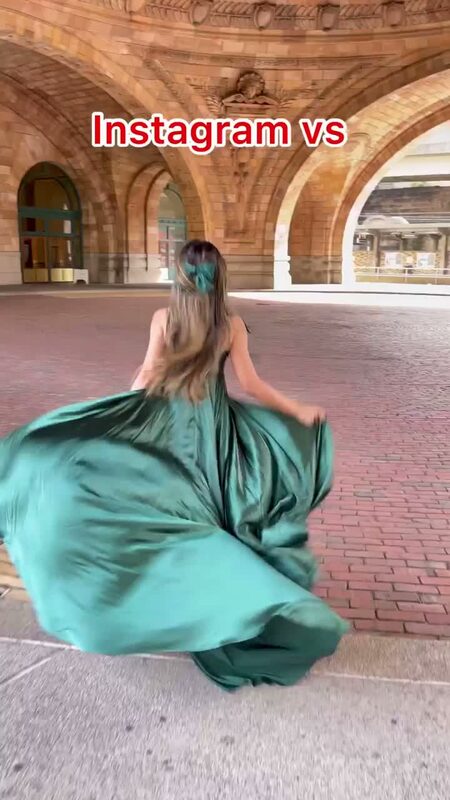 Roopsi Bansal from behind in a flowing emerald green satin gown, twirling under a Gothic domed stone archway, with the text 'Instagram vs' overlaid