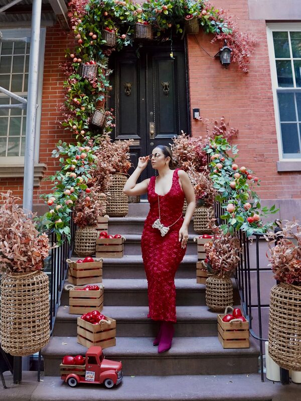 Roopsi Bansal in an apple-red autumn dress and Cosy Island boots