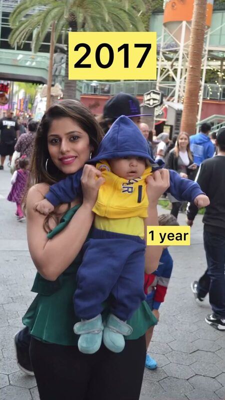 A trending reel comparing Roopsi Bansal carrying her son as a baby in a yellow and blue outfit at an outdoor plaza, labeled 2017 and 1 year, to who he is now