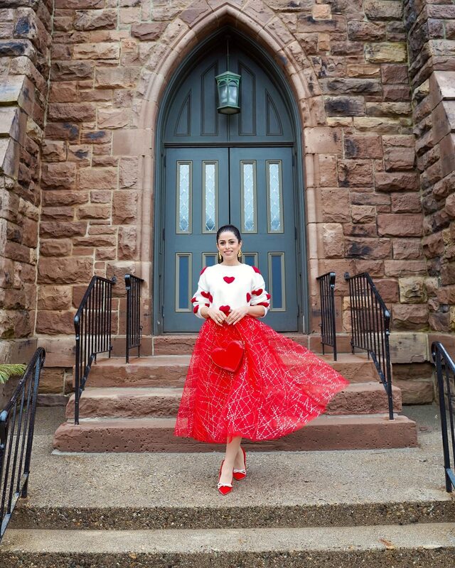 Roopsi Bansal in a red skirt from Chicwish and heels from Dream Pairs