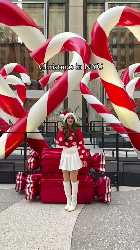 Roopsi Bansal in a Chicwish holiday look near a Christmas candy decoration in NYC