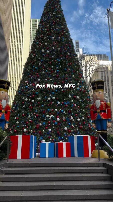 A giant Christmas tree flanked by nutcracker soldiers outside 1221 Avenue of the Americas, NYC