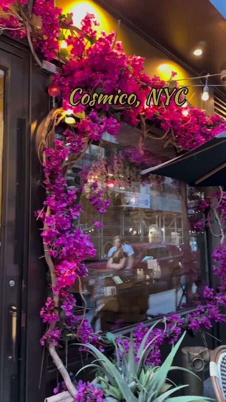 The bougainvillea-covered entrance of Cosmico restaurant in NYC