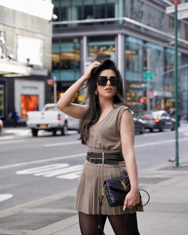 Roopsi Bansal in a cozy knit top and pleated skirt set from Chicwish