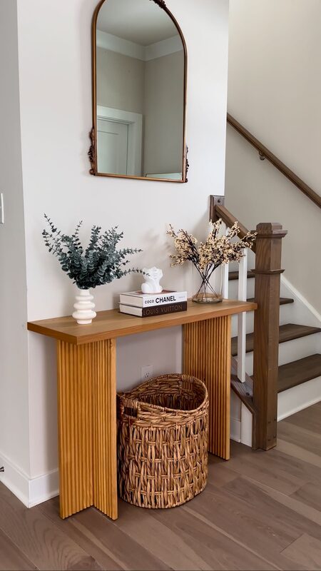 A console table styled with SHEIN home decor pieces including eucalyptus stems