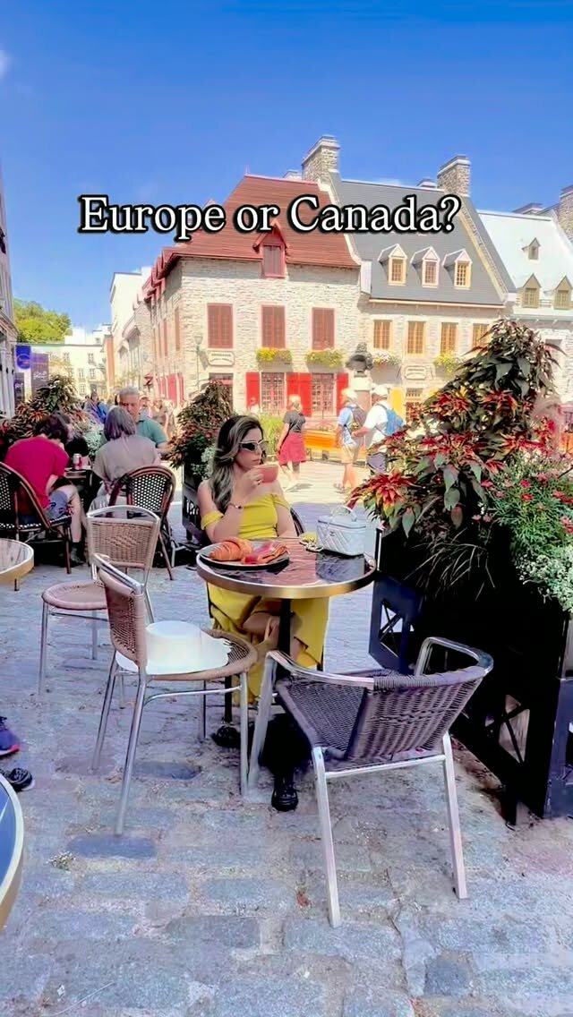Roopsi Bansal at an outdoor café table on a cobblestone street in Québec City