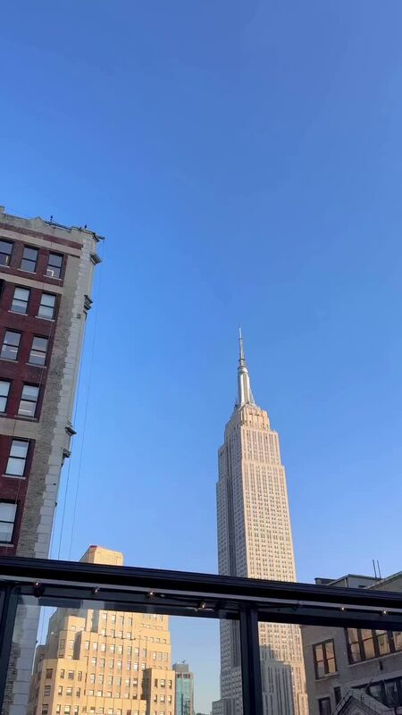 The Empire State Building rising above the skyline, seen from the Magic Hour rooftop in NYC