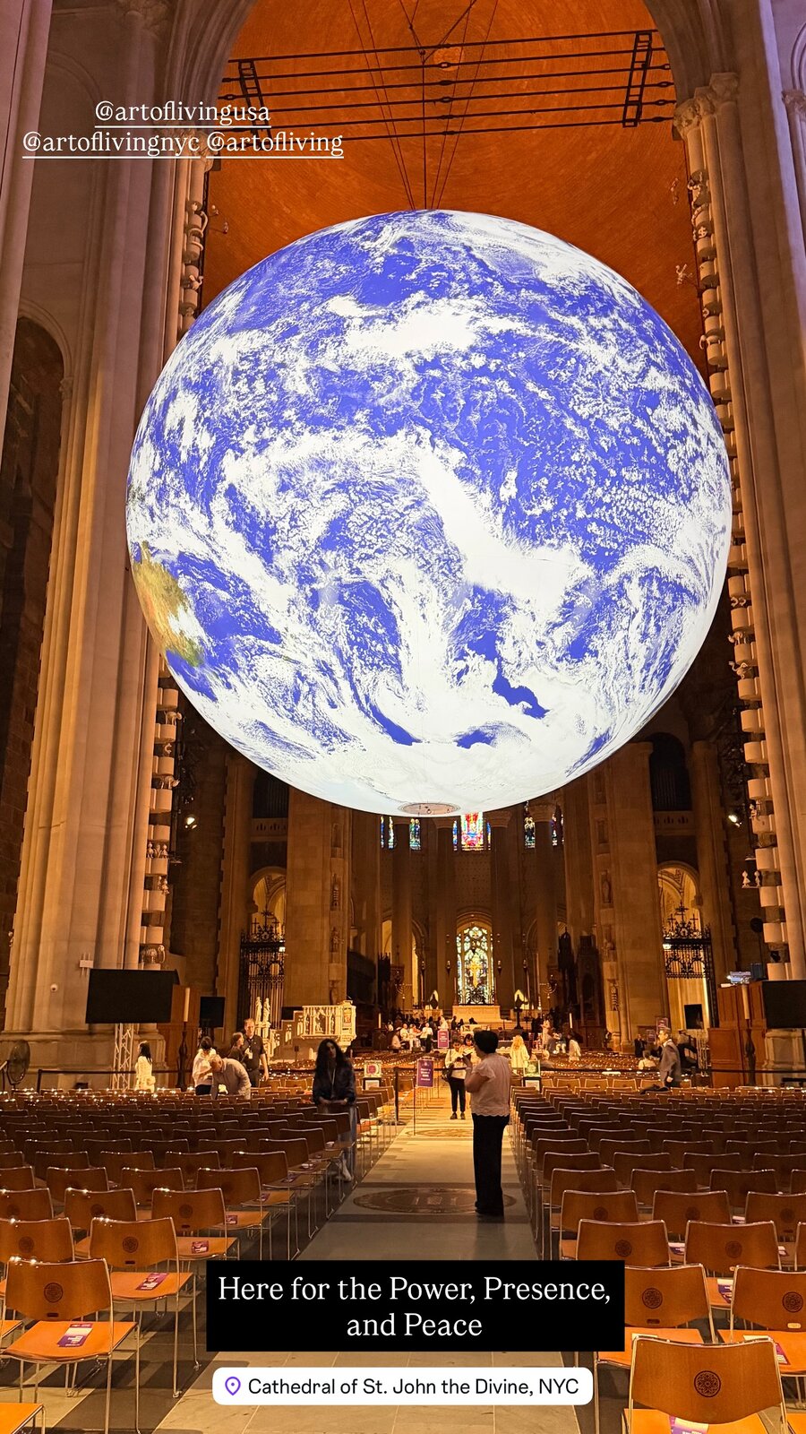 A giant illuminated Earth globe suspended inside the Cathedral of St. John the Divine