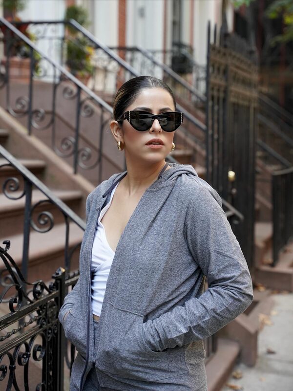 Roopsi Bansal wearing Fabletics activewear and Dream Pairs boots