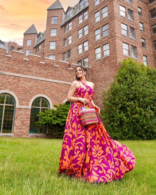 Roopsi Bansal in a sun-kissed orange and magenta print maxi dress from Mahamar