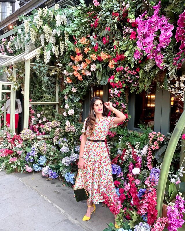 Topshop — A Topshop handbag outside a London storefront of flowers.