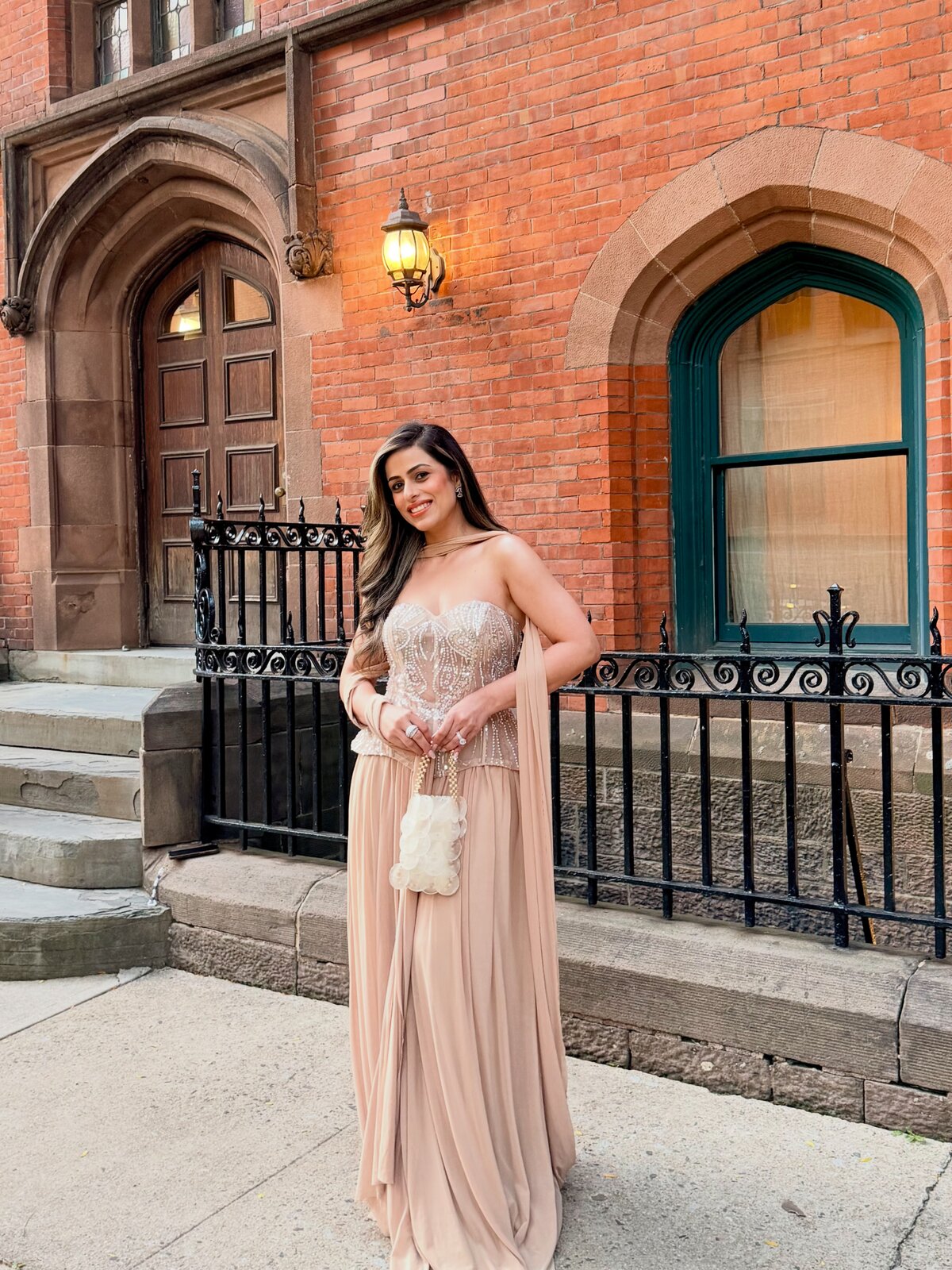 Roopsi Bansal posing with friends at the South Asian NYFW celebration
