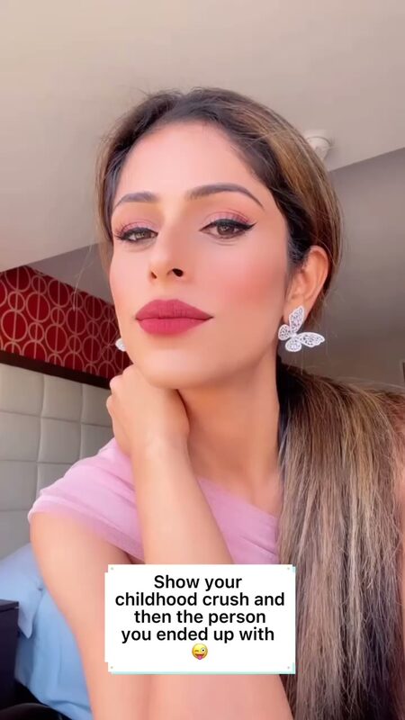 Roopsi Bansal in a close-up selfie wearing butterfly earrings, doing a trending childhood crush reel