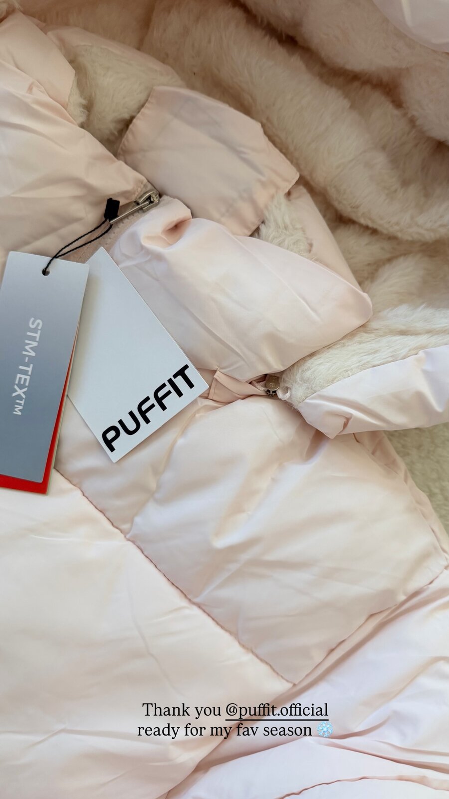 A pale pink faux-fur puffer jacket from Puffit Official