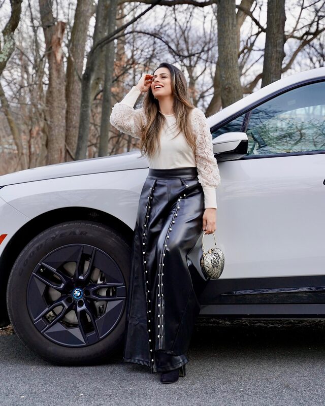 Roopsi Bansal wearing leather pants and a top from StyleWe