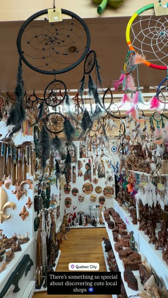 A souvenir shop in Quebec City packed with dreamcatchers, carved wooden figurines, and trinkets hanging from the ceiling
