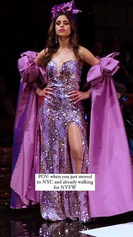 Roopsi Bansal walking the runway in a purple and gold sequin gown with a floral headpiece for New York Fashion Week