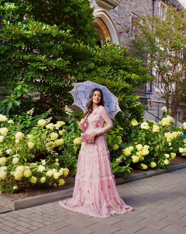 Roopsi Bansal in the Nydia Pink Floral Embroidered Maxi Dress from Frock and Frill with a Jaipur Rose clutch and a German Kabirski ring