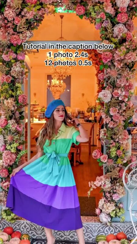 Roopsi Bansal in a green, teal, and purple color-block dress and blue beret, standing under a rose-covered archway with text overlay explaining a photo timing tutorial
