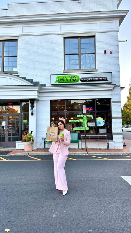 Roopsi Bansal in a Chicwish coat trying new Diwali flavors at Let's Yo Montclair
