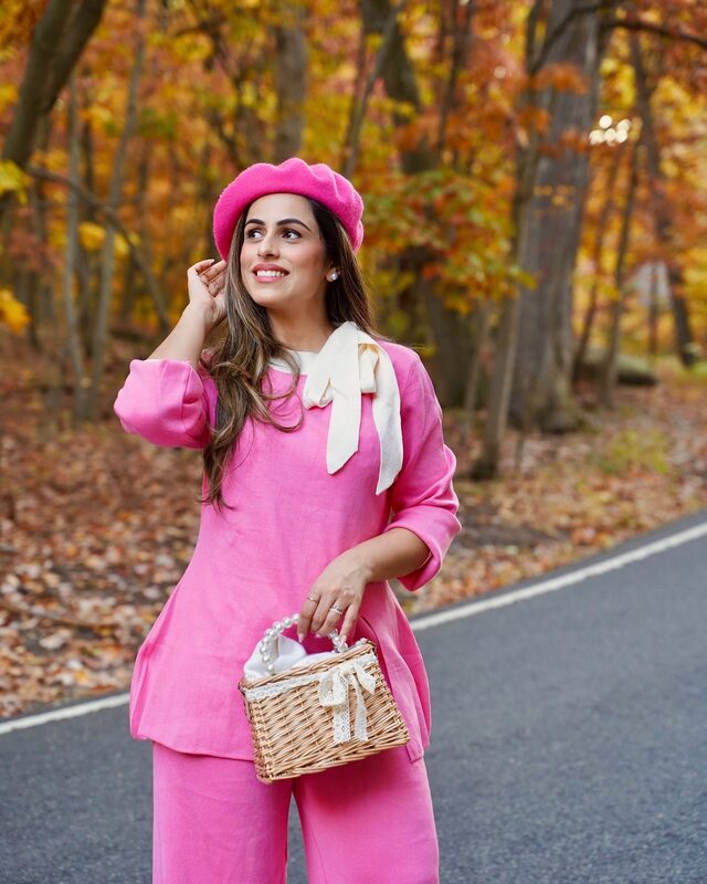 Roopsi Bansal in a candy pink knit sweater and pants set from Chicwish