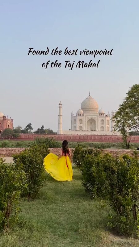 Roopsi Bansal in a yellow skirt walking through Mehtab Bagh Garden with the Taj Mahal visible across the Yamuna River in Agra, India