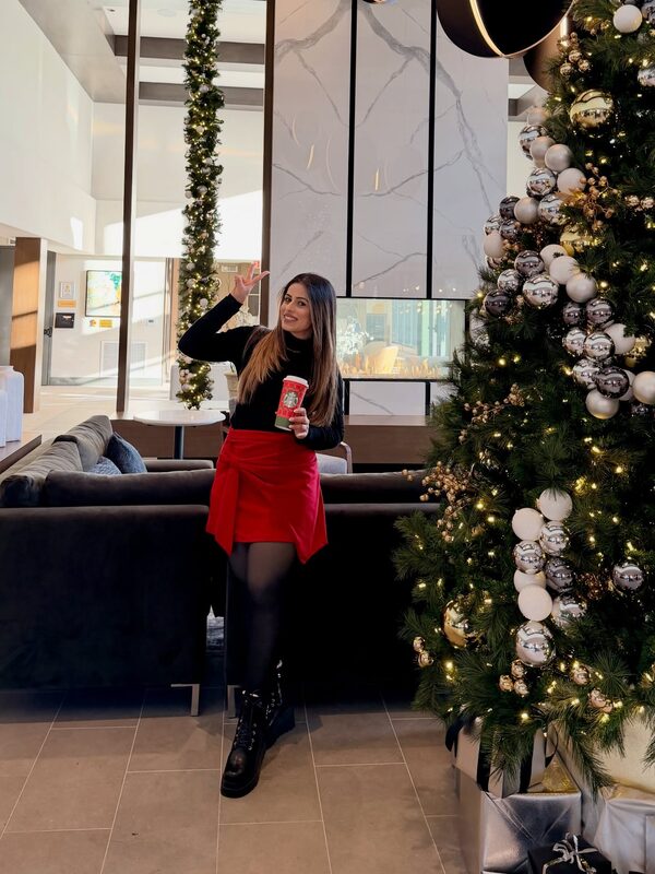 Roopsi Bansal amid twinkling holiday lights in Dream Pairs boots