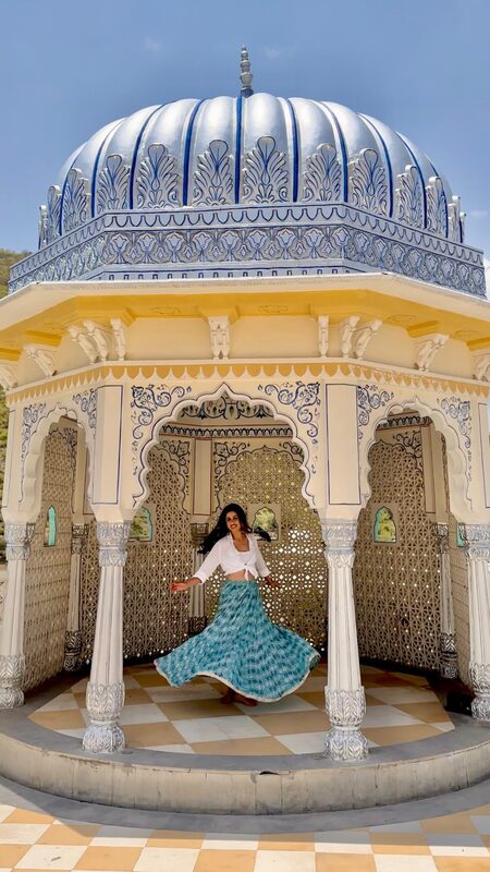 Roopsi Bansal twirling at The Leela Palace Jaipur in Rajasthan, India