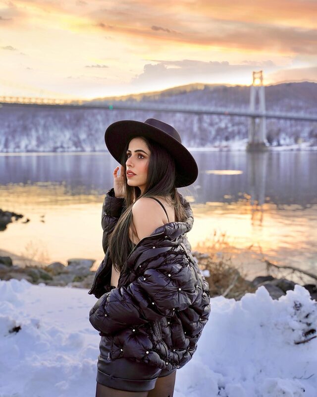 Roopsi Bansal in a winter jacket and hat for a cozy cold-weather look